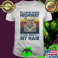 Hippie girl and dogs drive car on a dark desert highway cool wind in my hair shirt