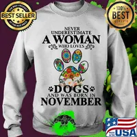 Never underestimate an old woman who loves dogs paw and was born in november s Sweater