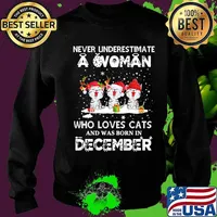 Never underestimate a woman who loves cats and was born in december christmas s Sweater