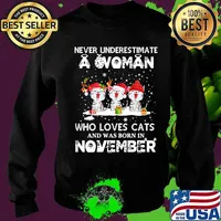 Never underestimate a woman who loves cats and was born in november christmas s Sweater