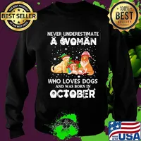 Never underestimate a woman who loves dogs and was born in october christmas s Sweater