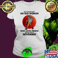 Never underestimate an old woman who loves hiking and was born in november blood moon s Ladies tee
