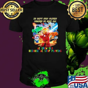 Superhero robots he don't stop playing because he grow old we grow old because we stop playing light shirt