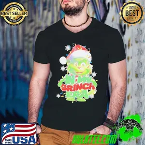 Santa hat in my Grinch era Christmas shirt